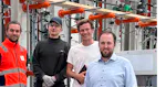The photo shows representatives from Arbonis and MINDA during the acceptance test.