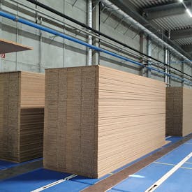 In the picture is a transport of raw boards