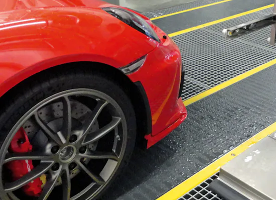 Car wash Ahlem The red front of a car from the side, still in a production facility