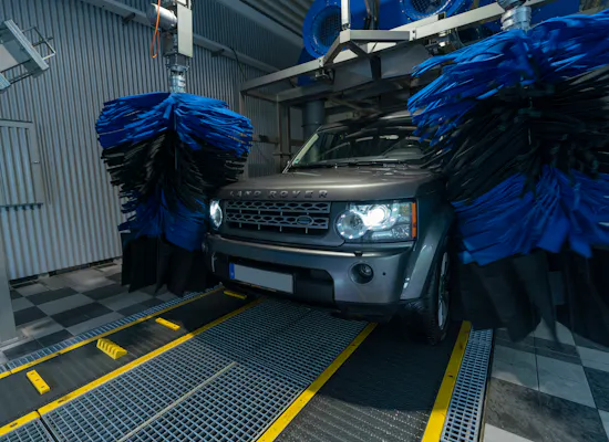Vehicle care Wiehl A Land Rover is being washed in a car wash.