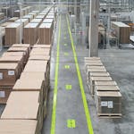 Lots of cardboard boxes sorted in an industrial hall